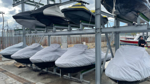 Jet ski storage racks at jetski.club workshop in Marina Santa Eulalia Ibiza storing Sea-Doo jet skis for maintenance and fleet management
