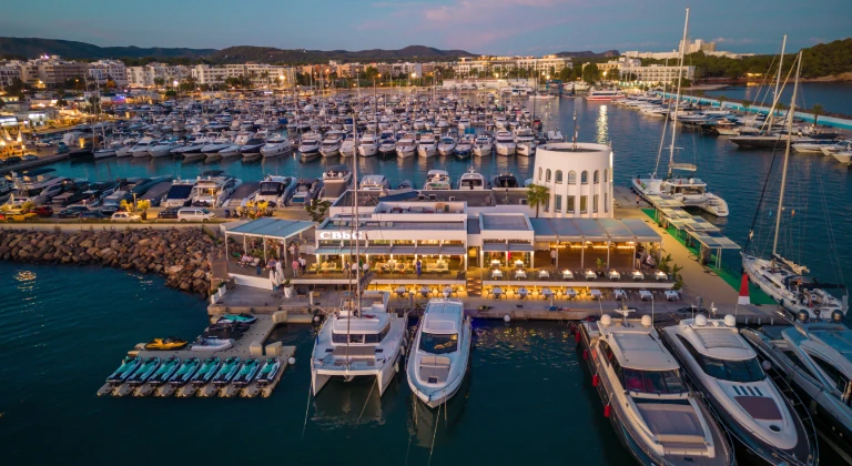 marina-santa-eulalia-ibiza-aerial-jetskiclub Aerial view of Marina Santa Eulalia in Ibiza with yachts, CBbC marina beach club and jetski.club jet ski platform