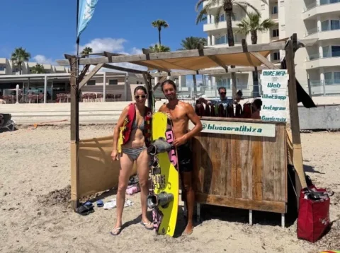 Jet ski booking hut on Playa d’en Bossa beach Ibiza with clients waiting near the shoreline