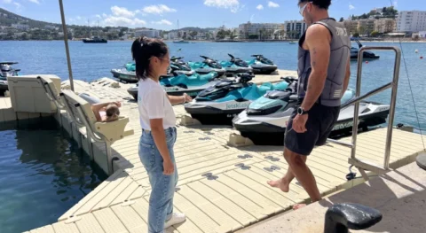Clients boarding jet skis directly from floating marina platform in Ibiza