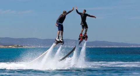Flyboard experience in Ibiza with rider performing above the water