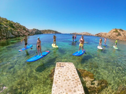 Paddle surf and kayak in Ibiza exploring clear water coastline