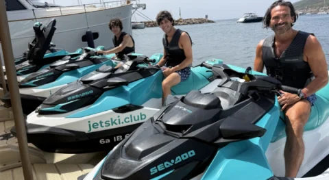 Father and two sons ready for a family jet ski tour in Ibiza